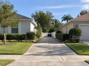 Shared driveway between residential properties in St Petersburg FL showing access area, neighboring homes, and property layout before surveying