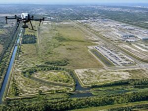 Drone conducting an unmanned aerial system survey over a large development site in St. Petersburg, Florida.